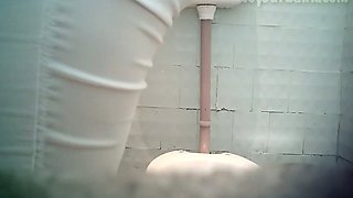 Pale skin amateur chick in the toilet room filmed fron frontside