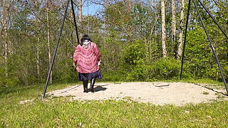 Molly swinging in the park in her beautiful sexy outfit