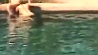 Two Busty Blondes in Bikinis Have Their Lesbian Sexy Time in the Pool