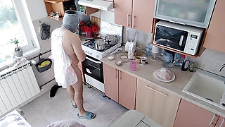 A hot amateur couple having fun in the kitchen.