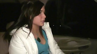 Two beautiful girls show off in a car