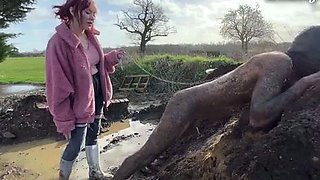 Extreme ballbusting in the mud Miss Eva Ray
