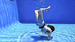 Provocative Cory Chase swims topless and fingers her wet pussy