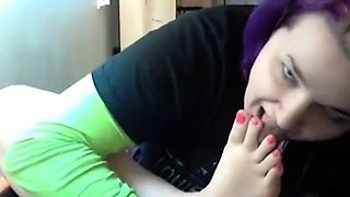 Goth emo girl licks her own feet