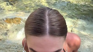 Buxom whore gives stranger blowjob and handjob on the beach