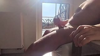 Dickflash in a hotel where a maid comes through the balcony and gets cum on her tits