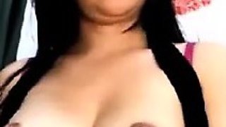 Latin babe presents her lactating tits