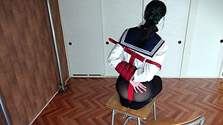 A Woman Is Being Punished While Wearing a Vibrator-equipped Chastity Belt.