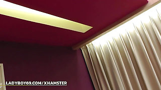 Long-haired ladyboy with natural boobs jerks off solo on the