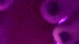 Young Girl Using Her Feet to Play with the Dildo While Masturbating