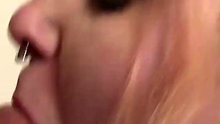 Blonde busty chick is pleasing guy's cock with her huge tits