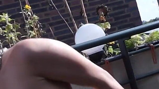 Hot and tattooed brunette is smoking a cigar and masturbating outdoors