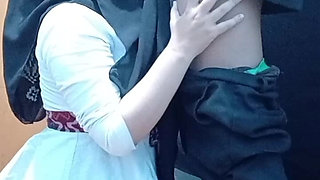 A Lonely Woman Wearing a Hijab in a Boarding