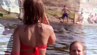 Beach voyeur finds a cute young babe in a sexy red bikini