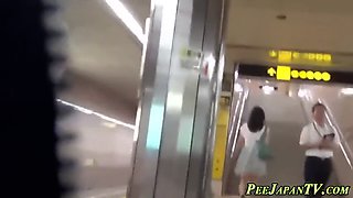 asian lady pees in toilet