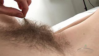 Selena plays with her Hairy pussy Solo