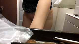 Big mature butt caught on a sitting on a toilet