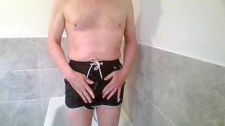 Desperate piss in cum splattered swim shorts.