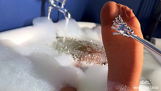 Scratching Mistress's Nylon Feet with a Scratcher in a Foam Bath