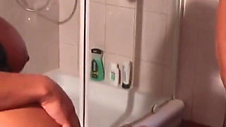 Two hot lesbians enjoys threesome with a huge cock in the bathroom