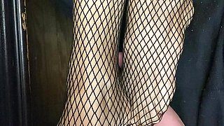 Tiny feet in fishnet stocking...red toe nails