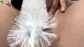 Brush masturbation with swollen clitoris