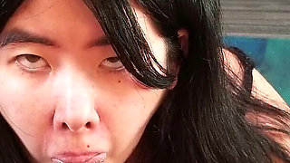 Chinese Girl Fits Her Tiny Mouth Around a Thick Black Cock