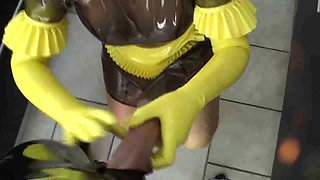Kinky dude in a latex suit fucks his plump maid slave
