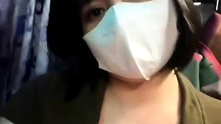 Teen on the bus hinting at showing breasts and being sensual