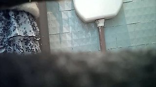 White stranger chick in the toilet room gets spied with camera