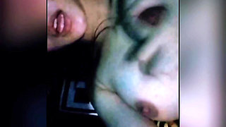Iying in the room while squeezing breasts