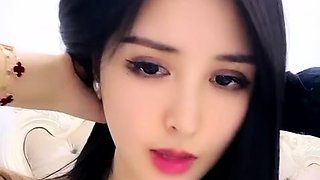 Asian girl moans loudly as she masturbates live on webcam