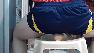 Vietnamese guy wearing soccer jersey and bouncing dildo