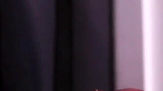 Redhead nurse sucks cock at a gloryhole