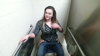 Big titted chick masturbates in public toilet