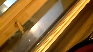 Standing on the Bare Chair in Front of the Window