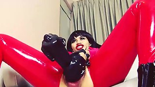 Horny brunette wearing latex while fucking a huge toy