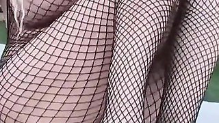 Beach Slut Masturbates in a Fishnet Suit