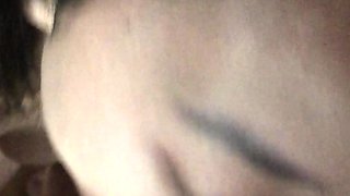 Asian bimbo sucks on a big cock close up