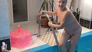 Gorgeous mature blonde Jitka is touching her shaved pussy in the pool