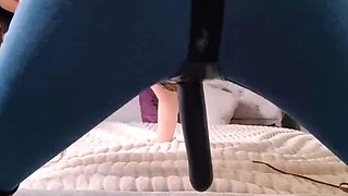Femdom vixen teasing with big strapon dildo on the bed
