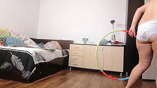 Amateur woman has fun trying on clothes and cutting them. Amateur woman vacuums naked in the house.