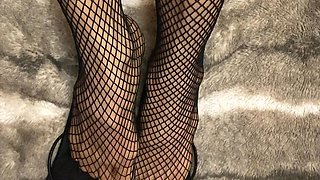 Fishnet in Open Toe Shoes with Red Nail Polish