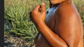 DRONE CATCHES  BLACK BBW MASSAGING HER BODY IN NATURE