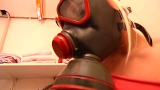 She Loves to Masturbate on the Toilet While Wearing a Gas Mask.