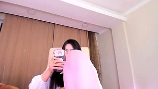 Shaved Asian milf squirting while masturbate on webcam