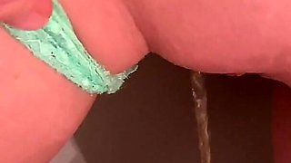 Piss on Her Pussy Lips While Shes Also Peeing on the Toilet