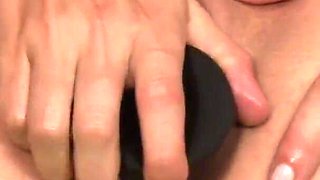 Horny brunette whore shoves two rubber cocks in her ass and pussy to satisfy herself