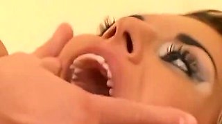 A Blonde in Leather Is Double Penetrated by a Man with a Strapon Until Cumshot