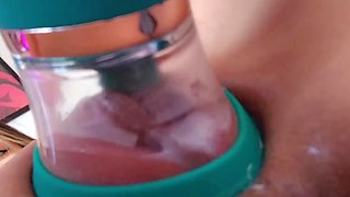 A nice juicy vagina is pleased with a special vacuum masturbator